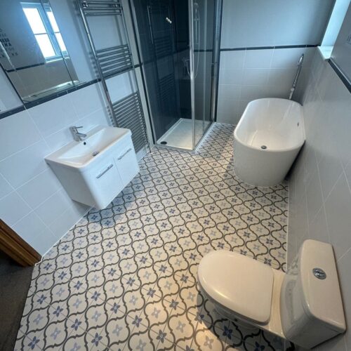 bathroom photo patterned floor tiles shower bathtub toilet sink